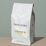 Emporium Espresso Blend by Cafellini tall rectangular white coffee bag with a light green labeling and gold inscriptions