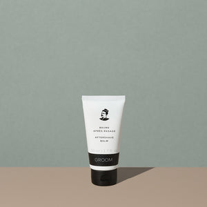 Groom aftershave balm in a white plastic squeeze tube with a black and white label of a mustache man