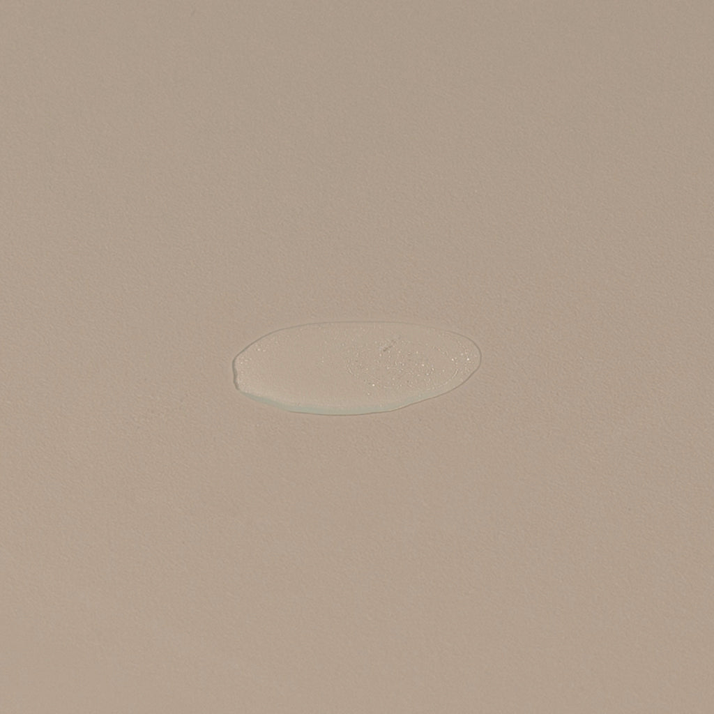 Groom aftershave splash transparent liquid spread on a table