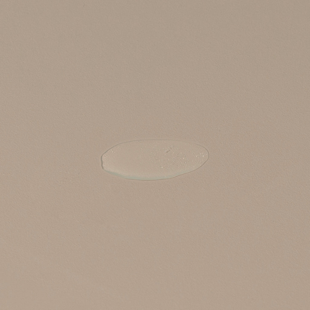Groom aftershave splash transparent liquid spread on a table