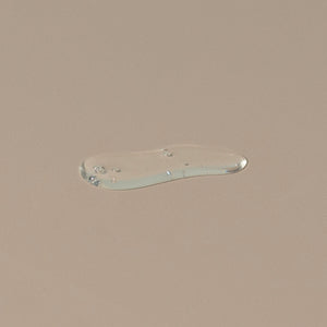 Groom beard shampoo transparent liquid texture liquefied on a table