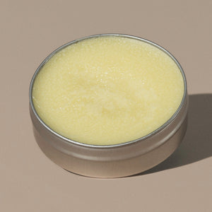 view inside yellow wax creamy Groom beard balm citrus in a rounded metal packaging 