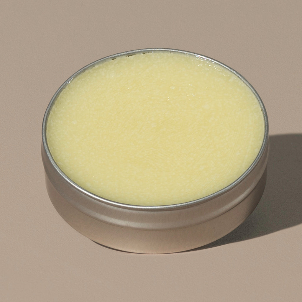 view inside yellow wax creamy Groom beard balm original in a rounded metal packaging 