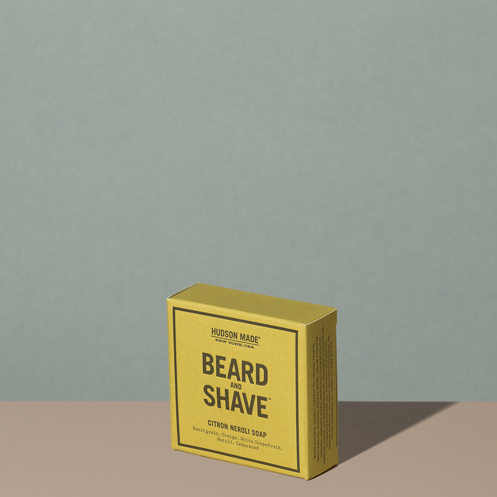 Hudson Made co beard and shave soap citron neroli in a square rectangle yellow cardboard packaging with black writings