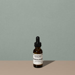 Hudson Made co beard and shave oil juniper myrrh in a 30ml amber rounded glass bottle with a glass dropper cap and a white label