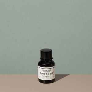 Hudson Made co beard and shave oil juniper myrrh in a 60ml amber rounded glass bottle with a plastic dropper cap and a white label