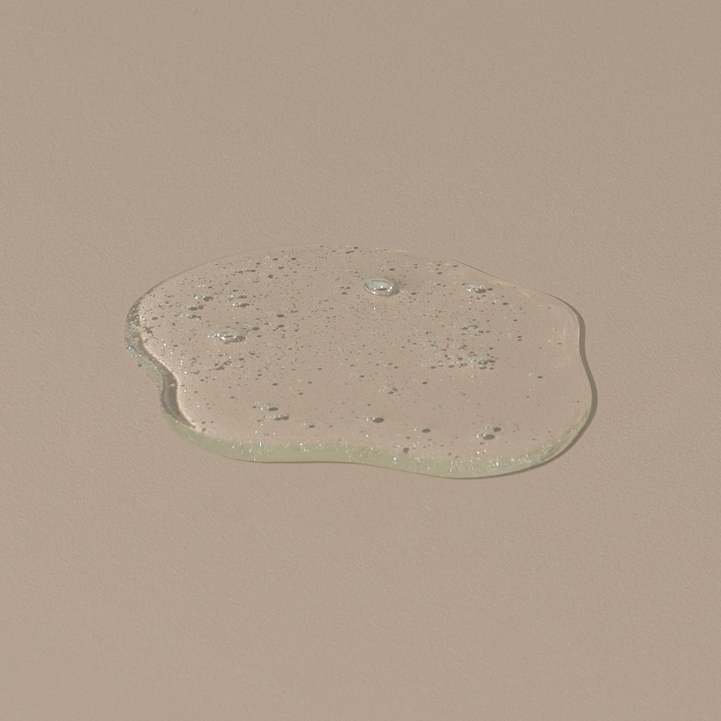 Hudson Made co morning shift hand soap transparent hand gel liquid dropped on a table