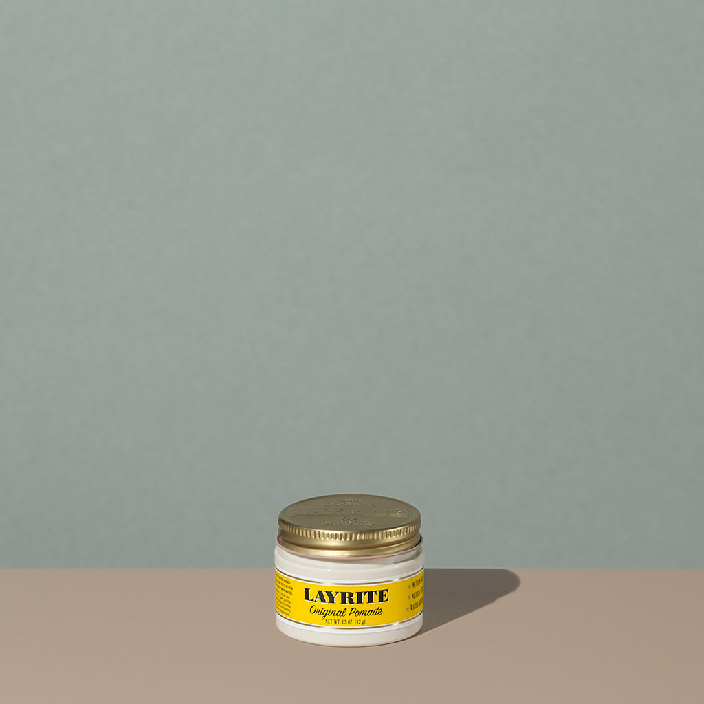 Layrite 1.5oz Original Pomade Medium Hold & Medium Shine hair pomade in a rounded white plastic container with gold twist cap and yellow label