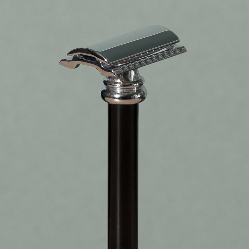 Close up details of tall 10 cm Merkur stainless steel Safety Razor with a Long Black Handle