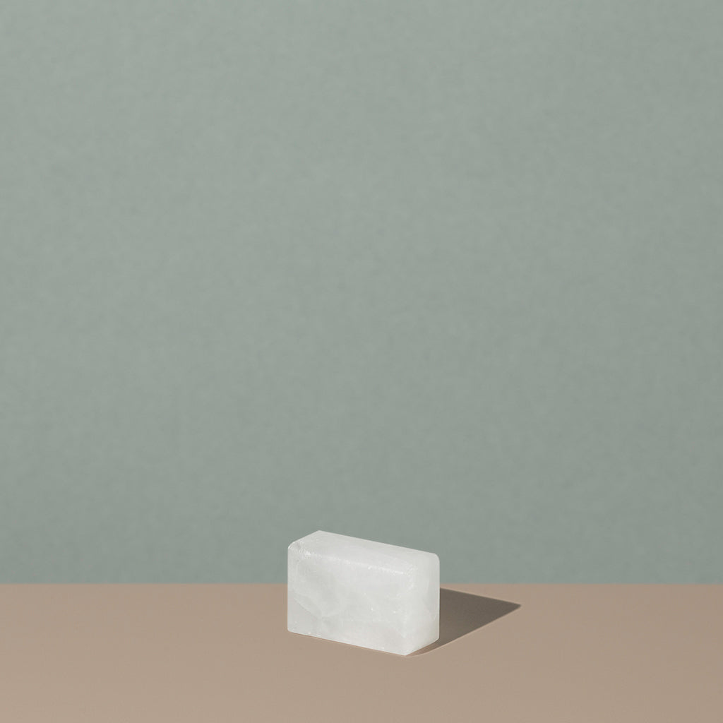 Osma bloc d'alun out of the packaging is a white see through rectangle salt stone
