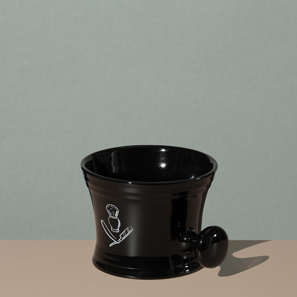 Pure badger shaving porcelain shaving mug with handle in black with a white logo