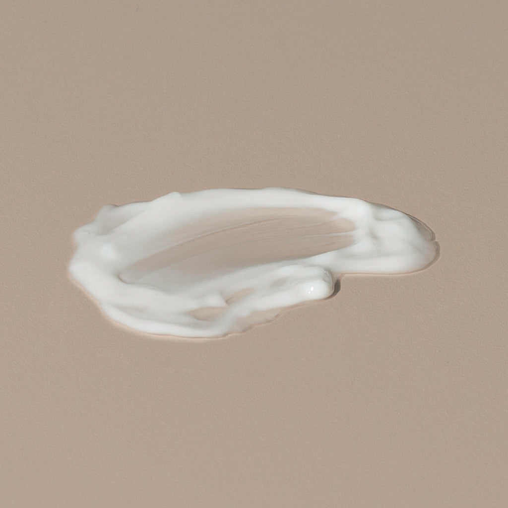 Salt & Stone antioxydant facial hydrating lotion creamy white texture spread on a table