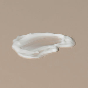 Salt & Stone antioxydant facial hydrating lotion creamy white texture spread on a table