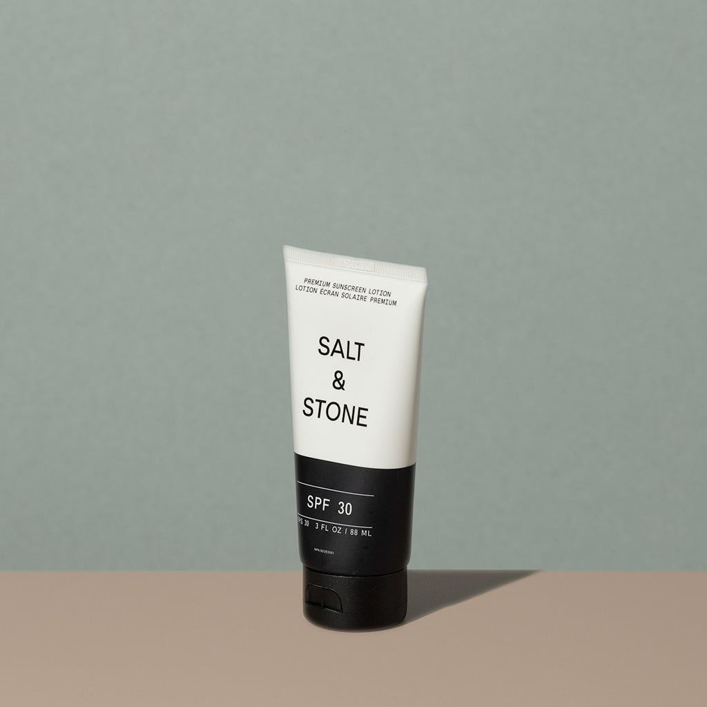 Salt & Stone sunscreen Lotion FPS 30 in a half black half white recycled plastic tube with a flip it black dispenser cap and black and white writings