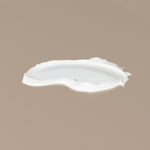 Thinksport 50+ FPS sunscreen white creamy texture spread on a table