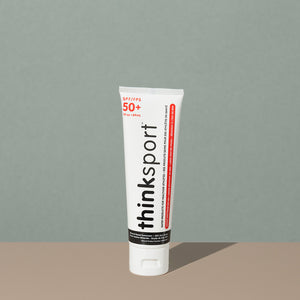 Thinksport 50+ FPS 3oz sunscreen in a white plastic tube with flip dispenser cap and black and red writings