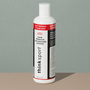 Thinksport shampoo and body wash in a white long cylindric plastic bottle with a press dispenser cap and a white, red and black labeling